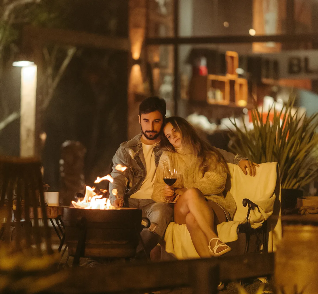 Pergola structure that adds privacy and defines a cozy outdoor living zone