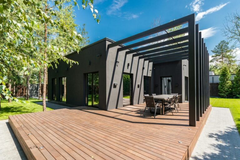 Modern backyard deck with pergola and dining area for homeowners choosing a deck builder in Charlotte NC
